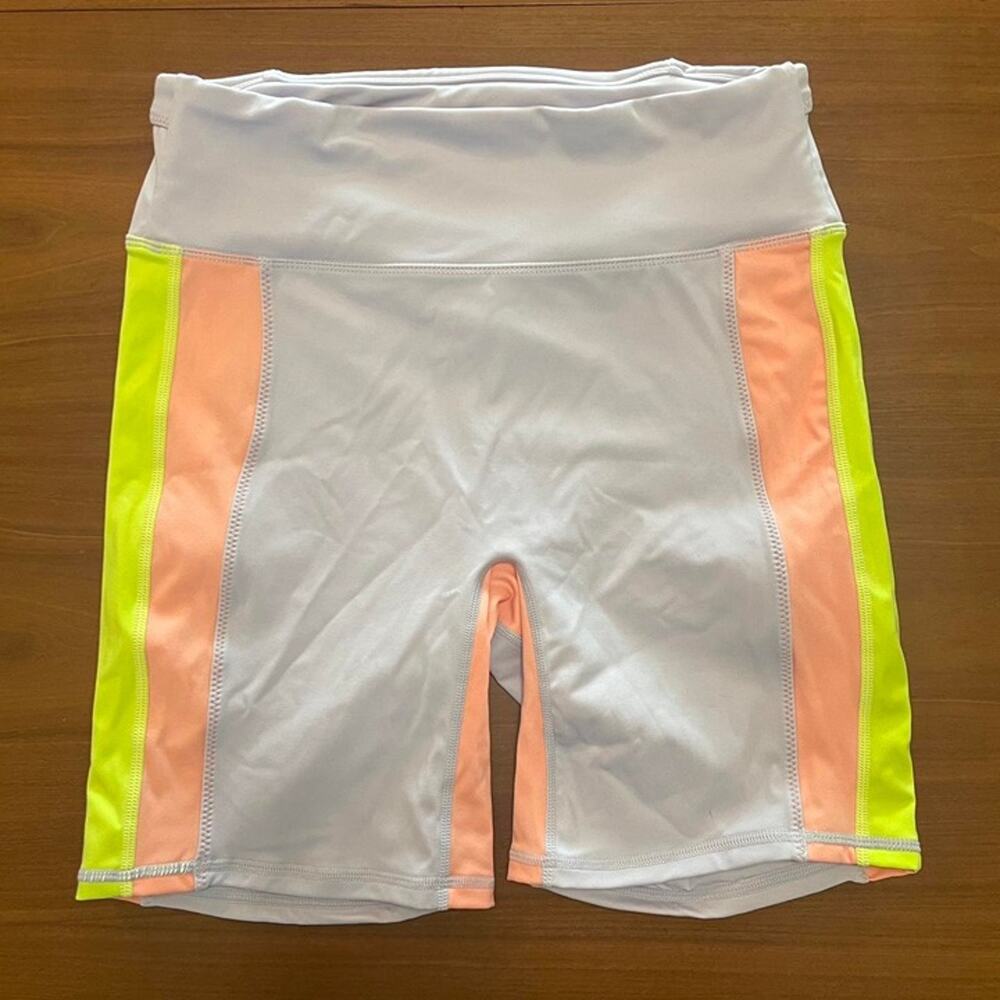 Fabletics, neon pink, yellow and lilac trinity bike shorts. size: M